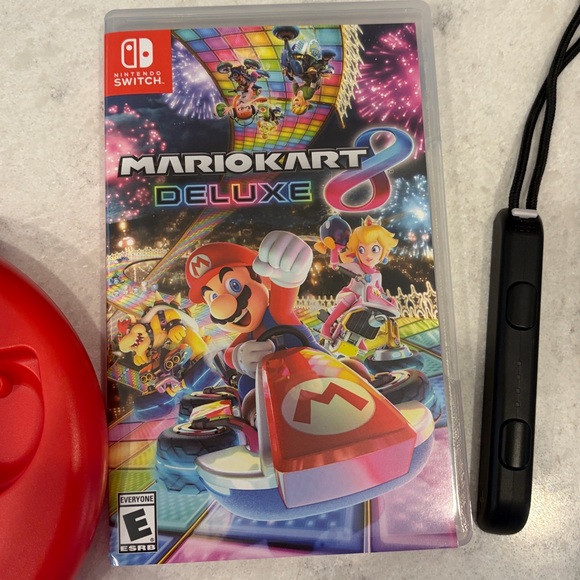 Nintendo Switch Console with Vibrant Red and Blue Controllers - Picture 3 of 8